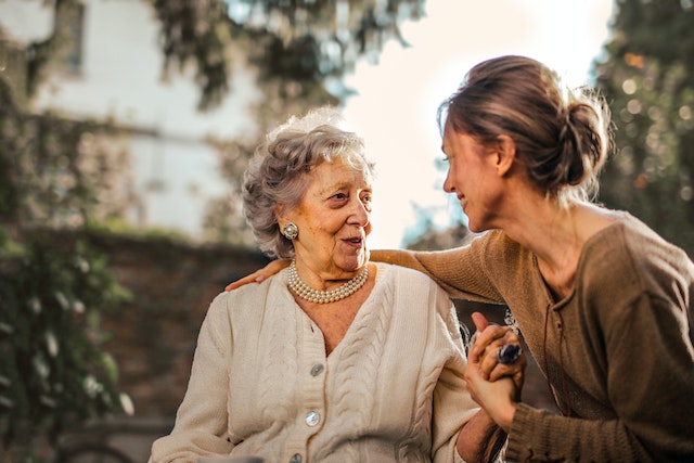 a joyful daughter talking with her mother