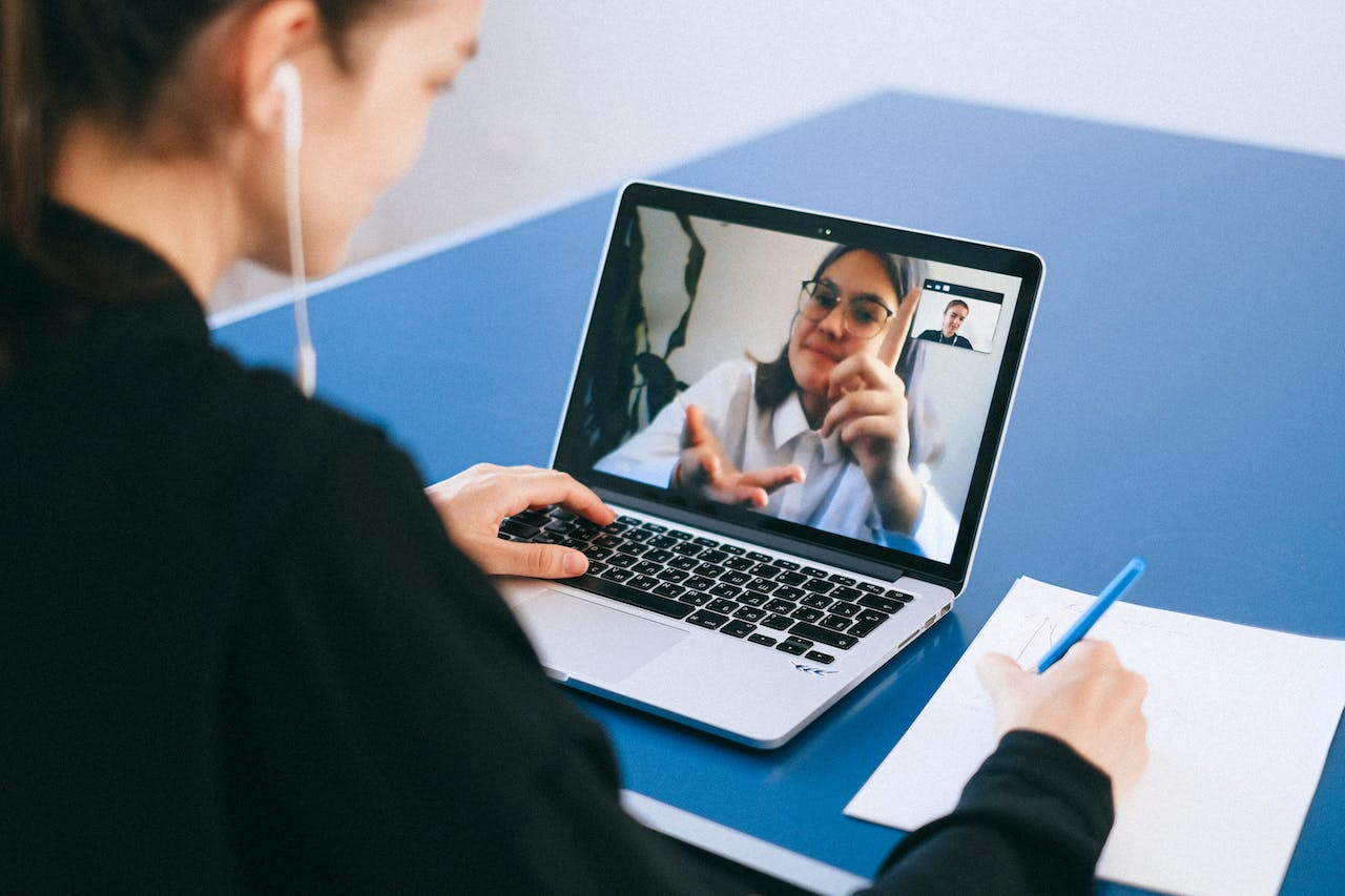 a woman using video relay systems to communicate