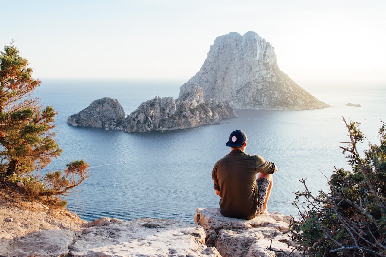 a man sitting by on a island